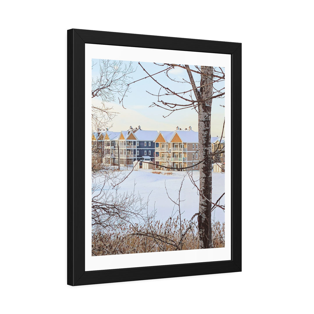 Modern colorful houses framed by snowy trees in a tranquil winter setting. - Bromont Media