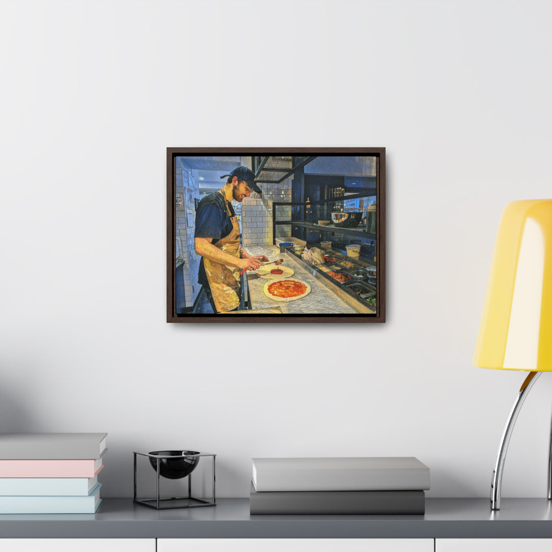 Framed artwork of a chef at Restaurant 900 in Bromont, Quebec, preparing pizza. - Bromont Media