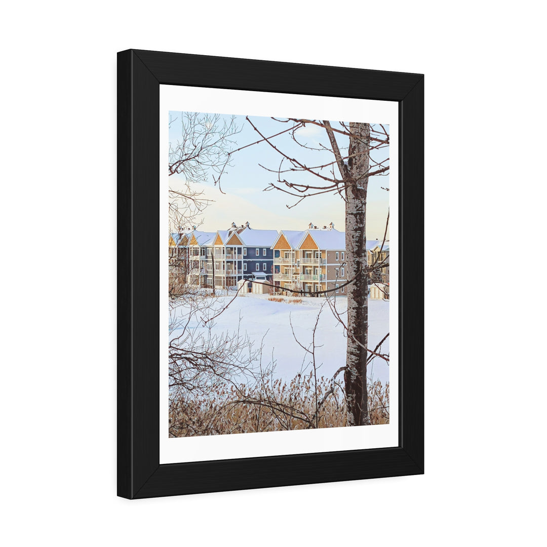 Winter landscape art with colorful houses in a thick black modern frame. - Bromont Media