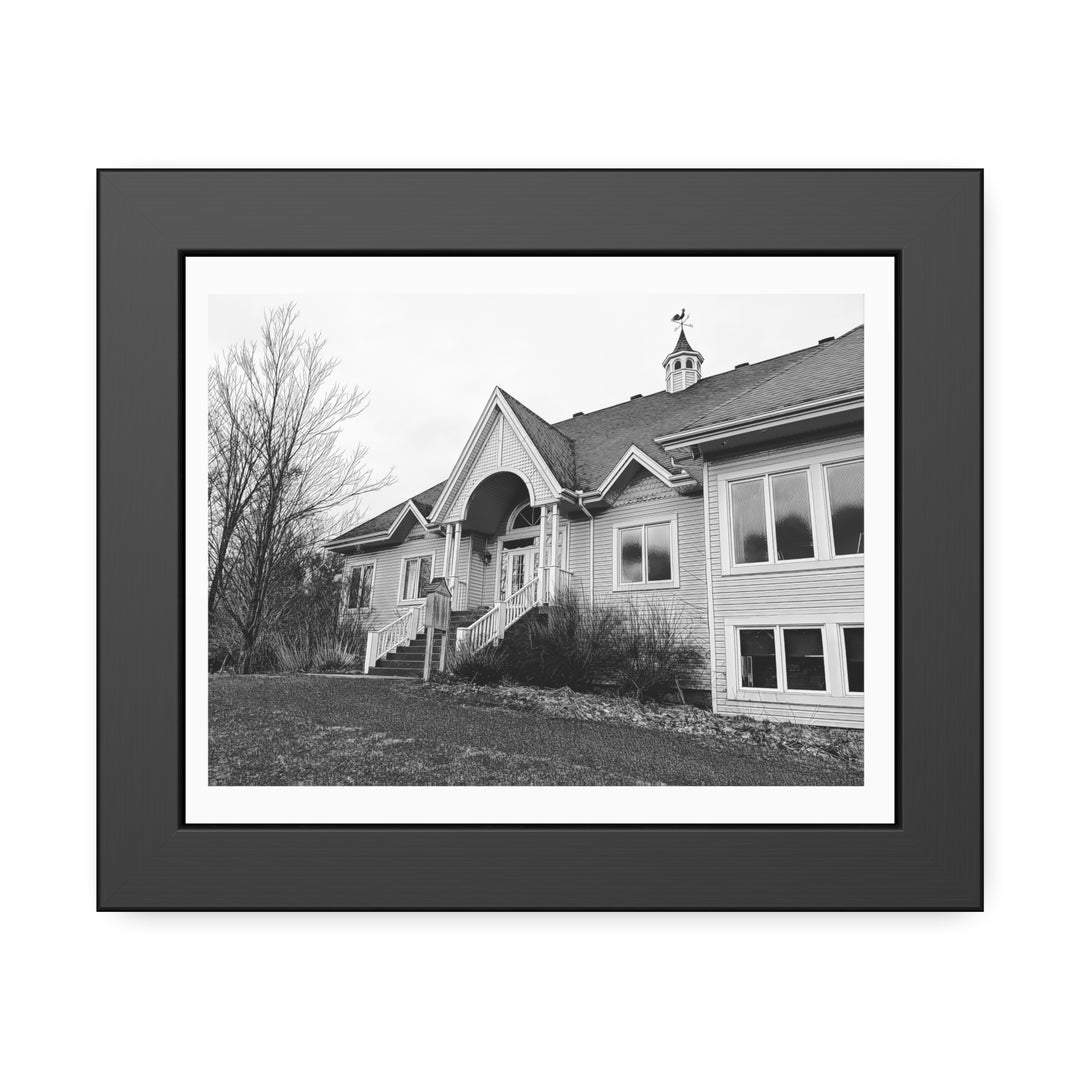 Black and white framed photograph of the Golf du Vieux Village clubhouse in Bromont, Quebec, featuring its elegant architecture and peaceful natural setting. - Bromont Media